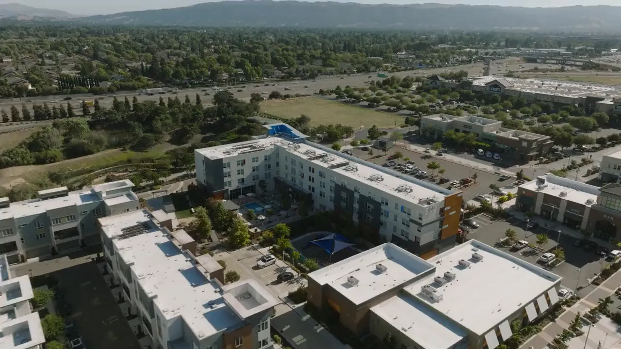 Aerial view of the Aloft Dublin property against green hills